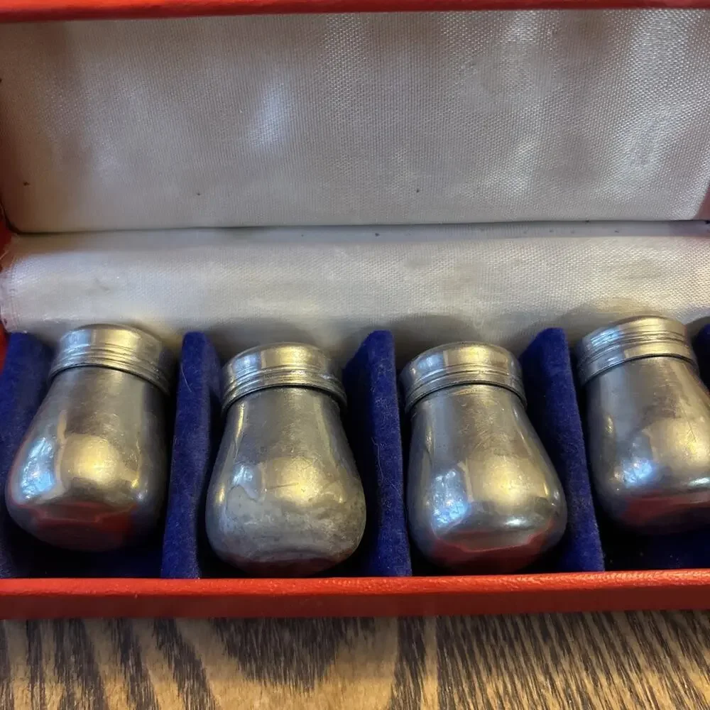 4 Salt and Pepper Shakers in Original Box pre owned silver colored